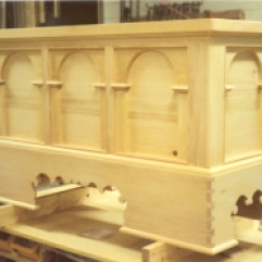 The elaborately fret-sawed base profile is typical of many continental chests.